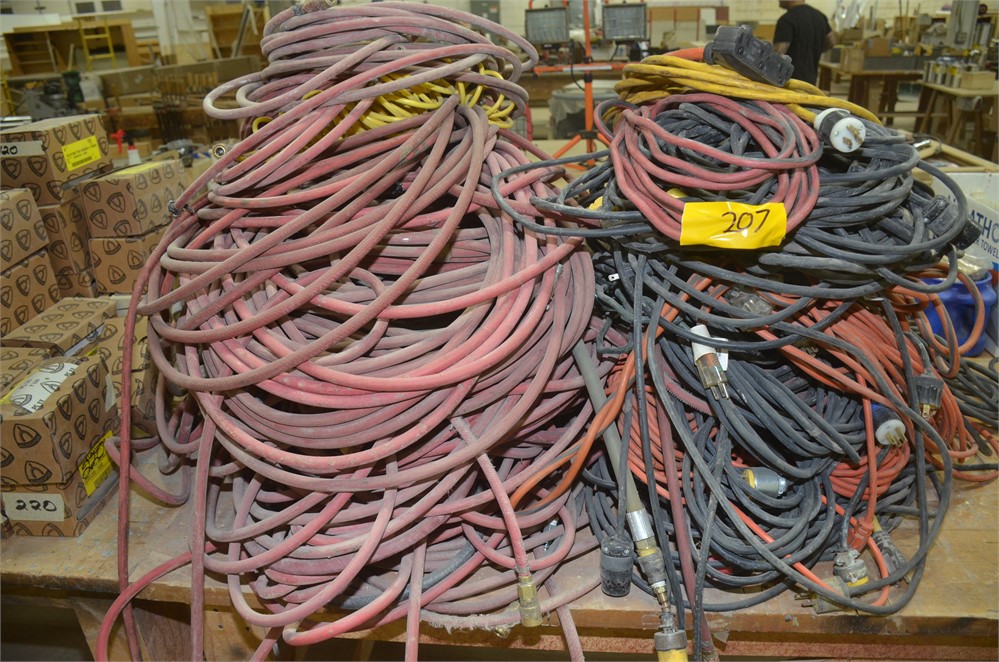 Lot of misc electric cords and pneumatic hoses