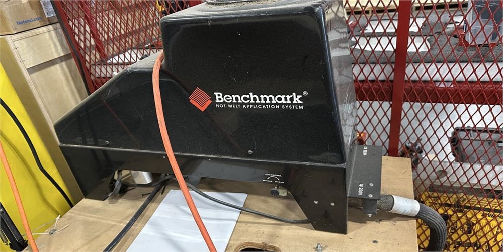 Benchmark hot melt glue application system