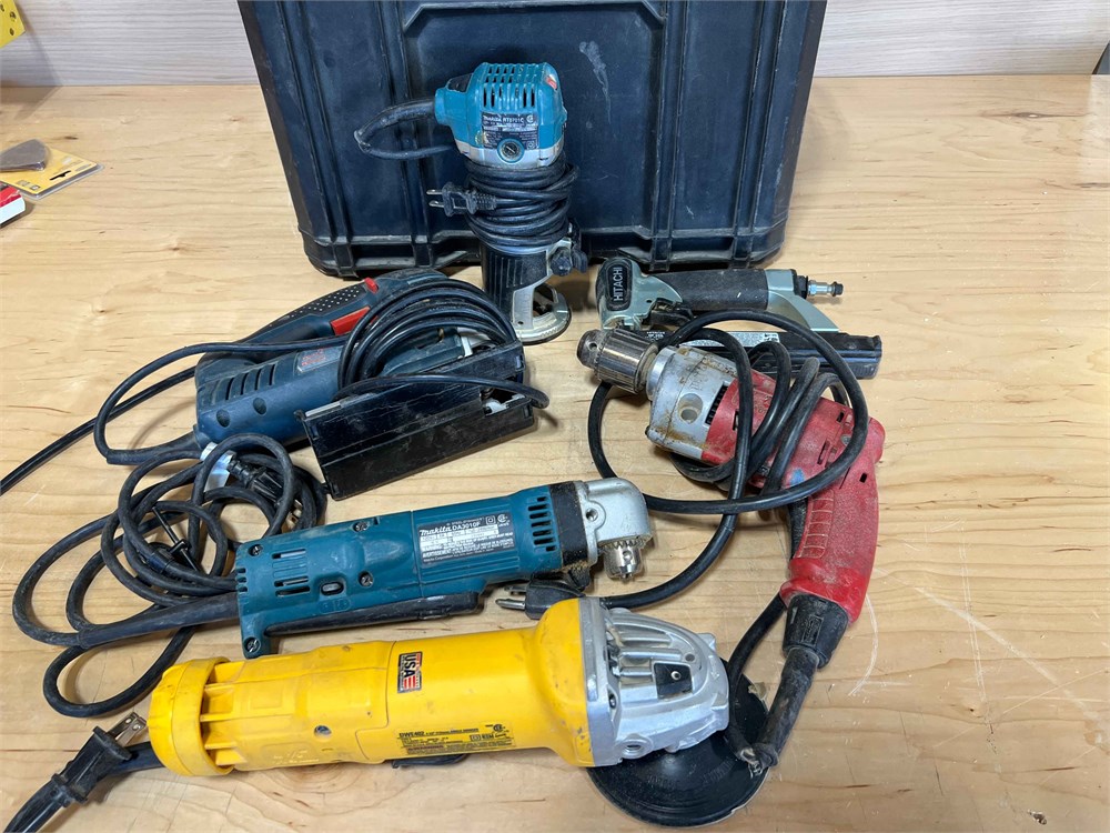Drills, trim router, angle grinder, jig saw in rolling tool box